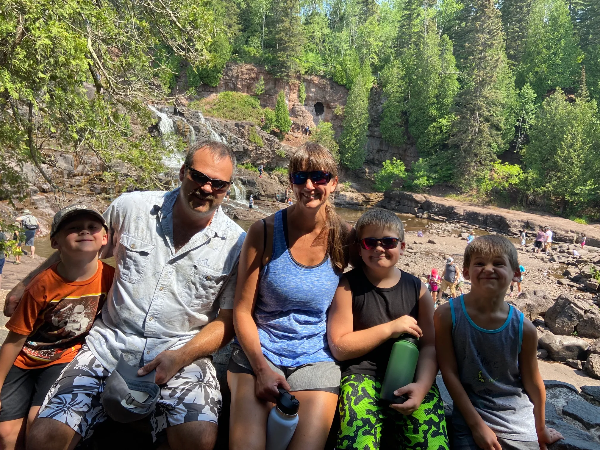 image of family at water fall - reasons to love your husband