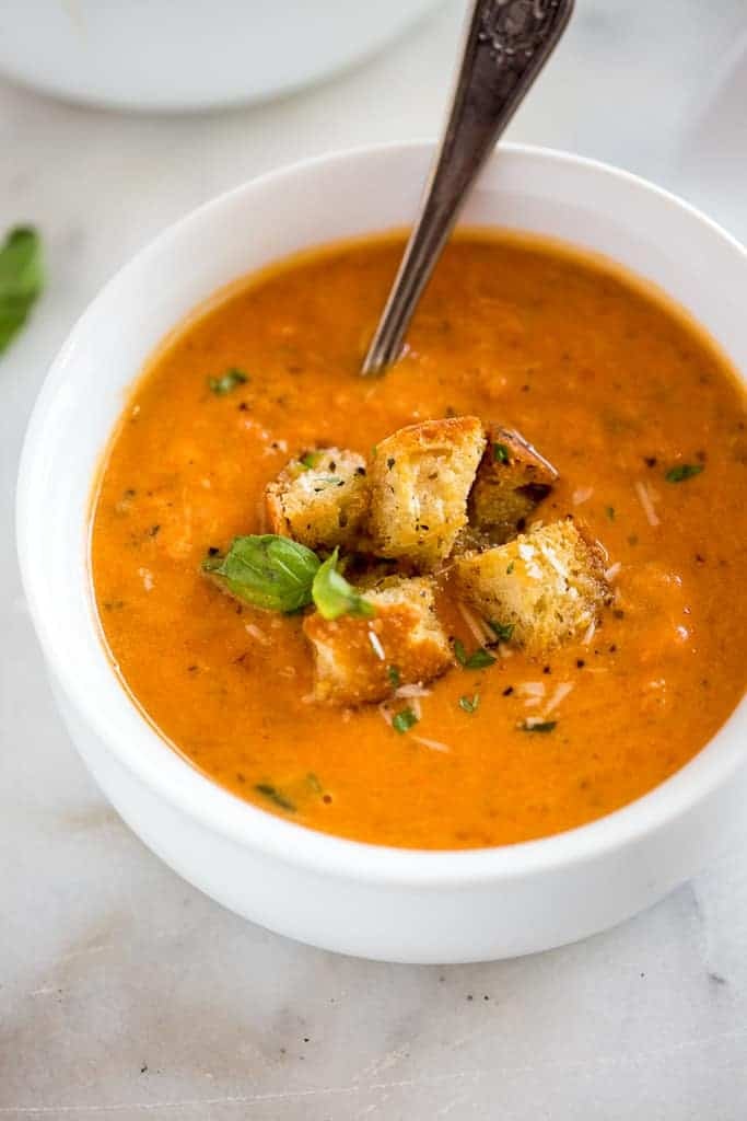 Image of tomato basil soup in a white bowl