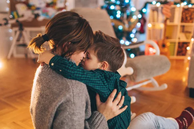 image of mom and child hugging at Christmas
