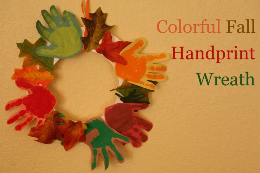 image of a colorful fall handprint wreath 