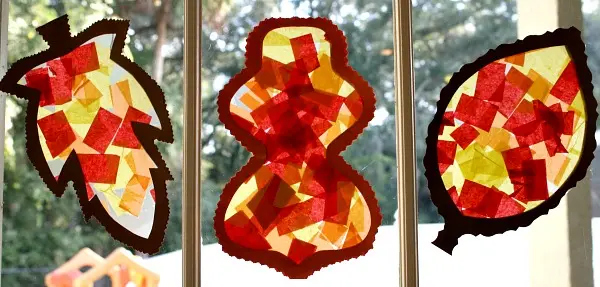 image of sun catchers on a window in the shape of leaves