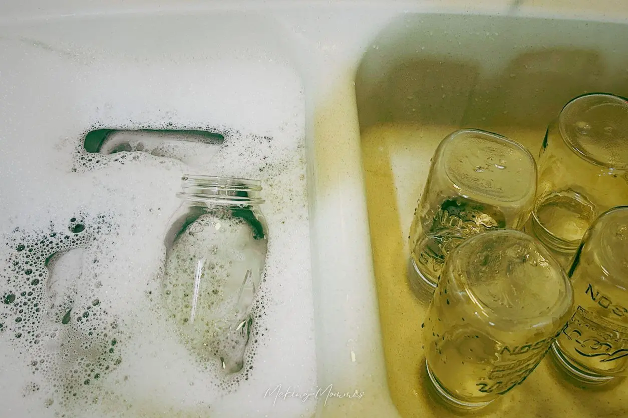 image of jars in a sink being washed