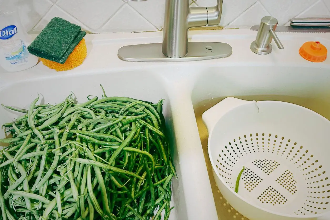 green beans in a sink