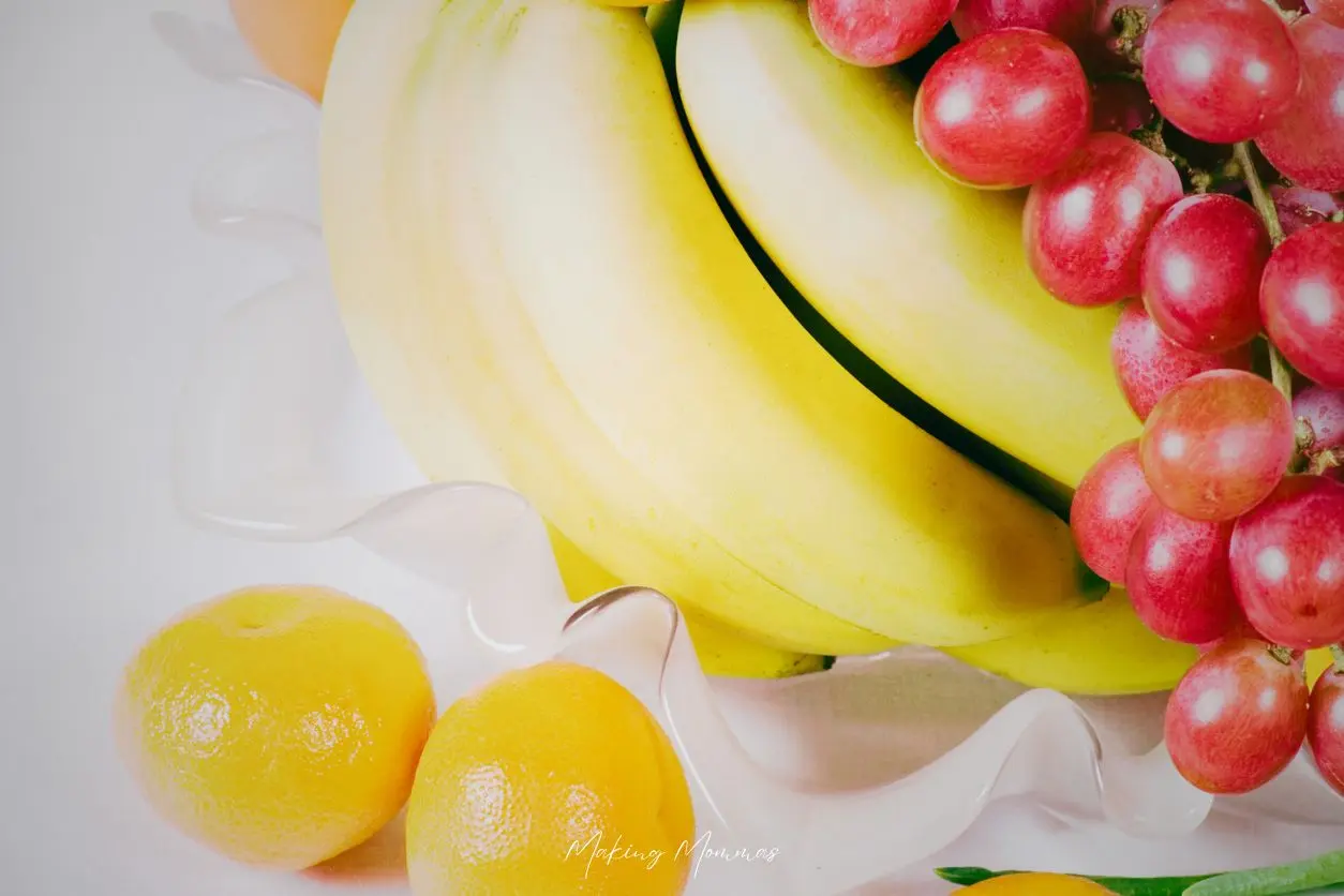 image of bananas and grapes and oranges