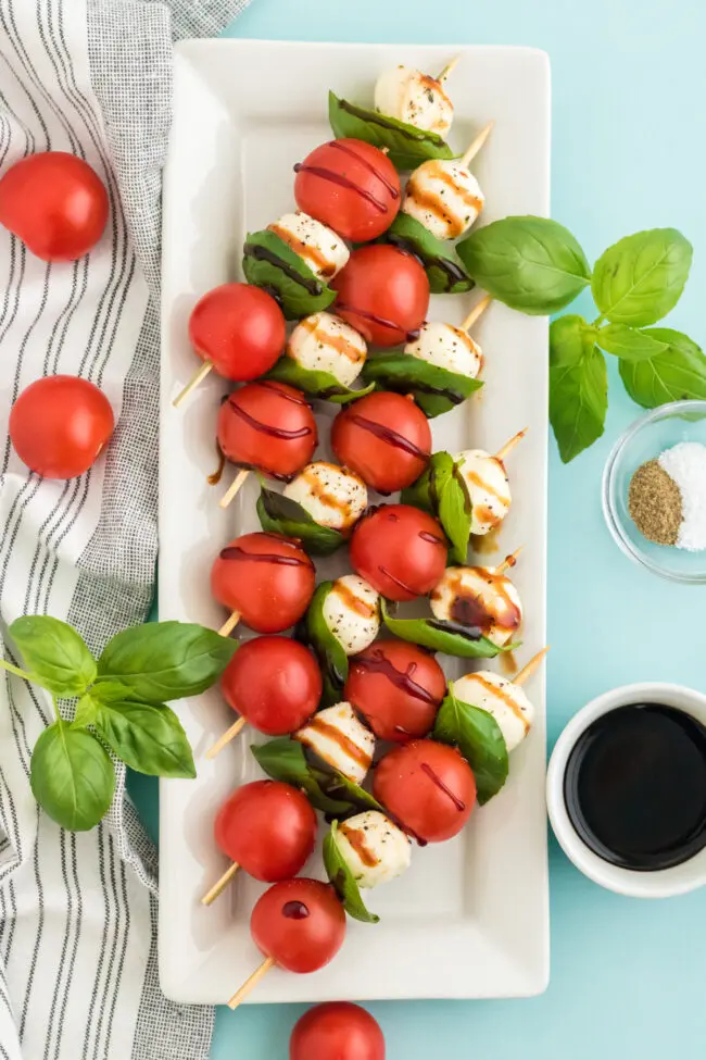 image of cheese and tomato caprese salad skewers