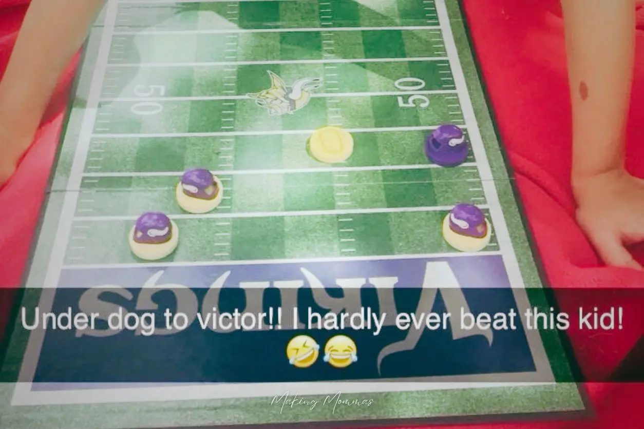 image of a little kid playing Vikings Checkers, that reads, "Under dog to victor!! I hardly ever beat this kid!"