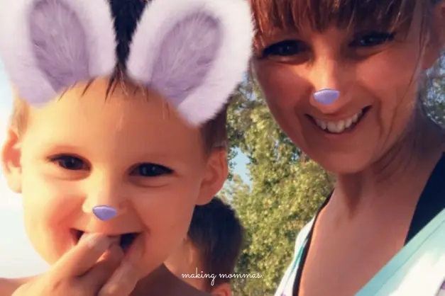 image of mom and boy with bunny ears and nose