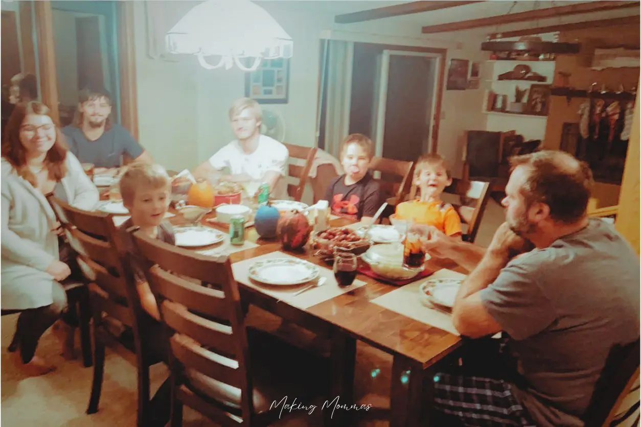 image of a large family gathered around the dinner table