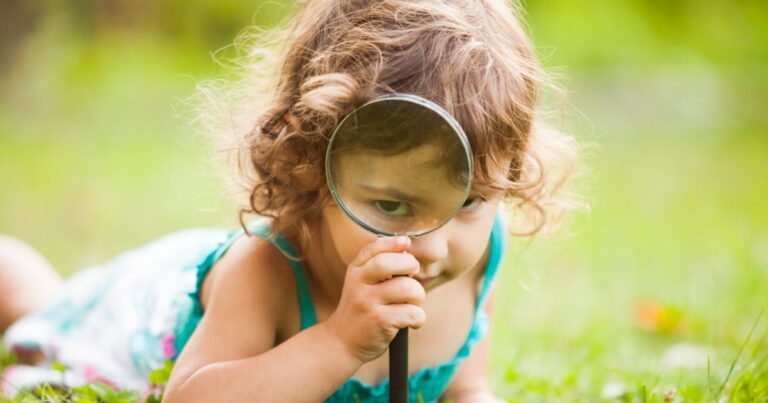 image of girl with magnifying glass