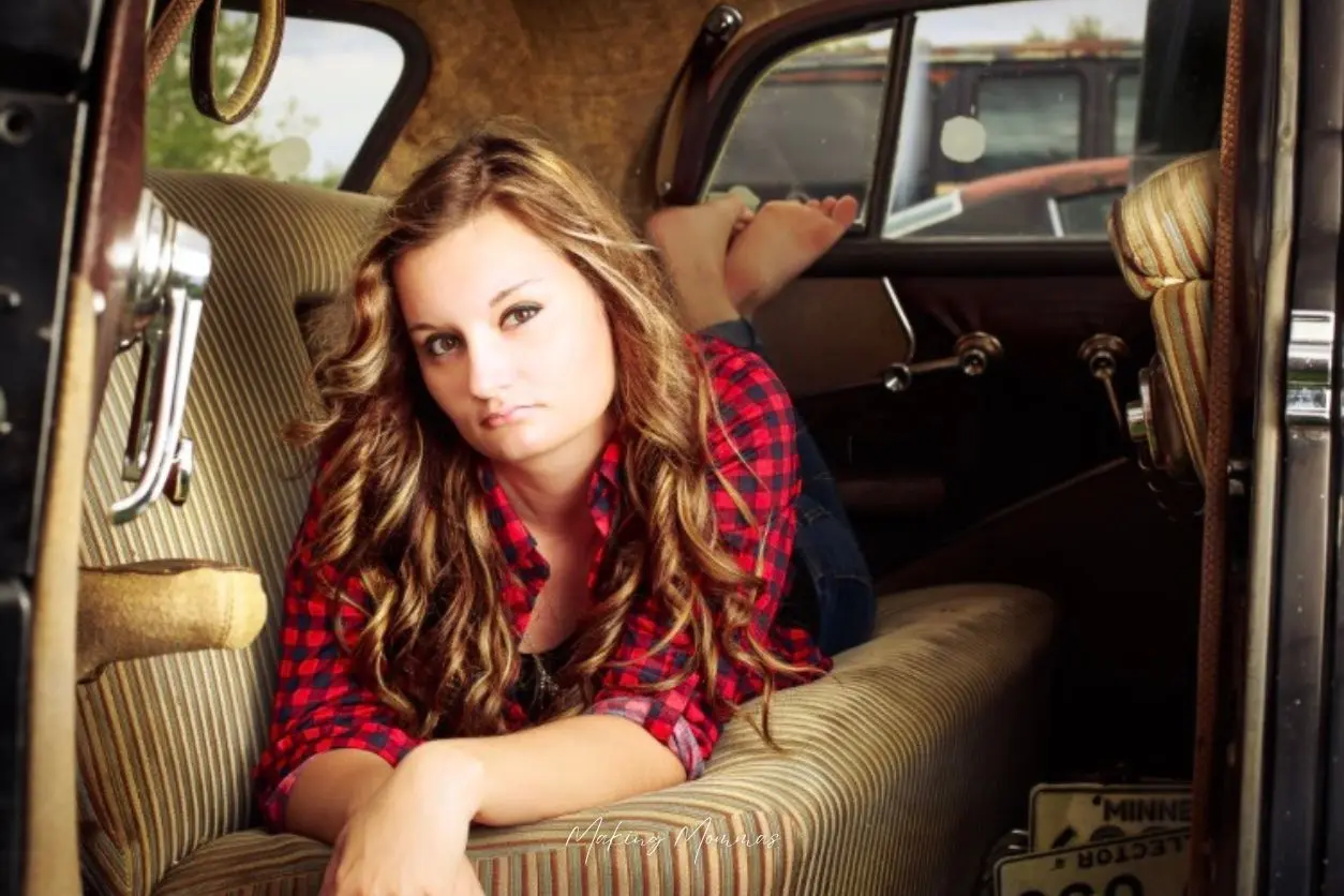 image of a beautiful woman in an old car