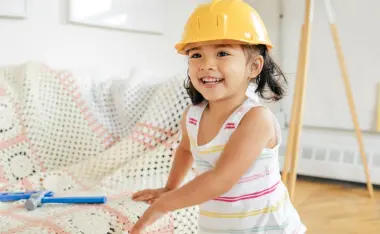 image of a toddler in a construction hat