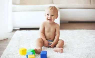 image of a toddler playing with blocks