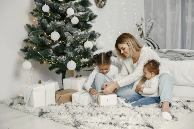 image of mom and two little girls at Christmas