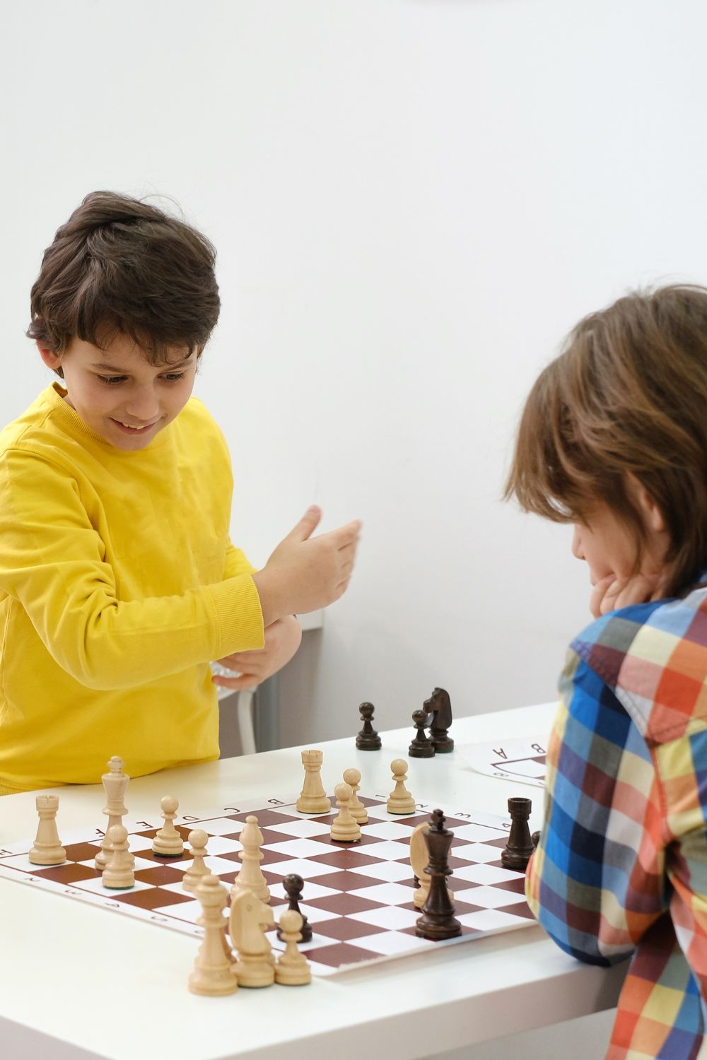two kids playing Chess