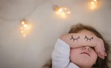 image of a toddler getting ready to wake up 