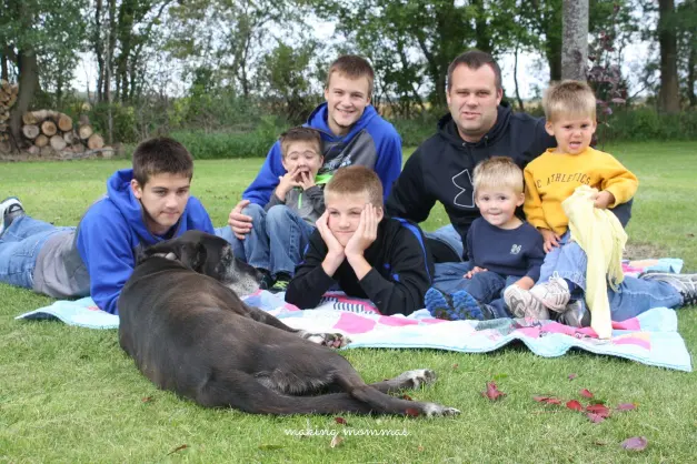 image of a family of boys and a dog