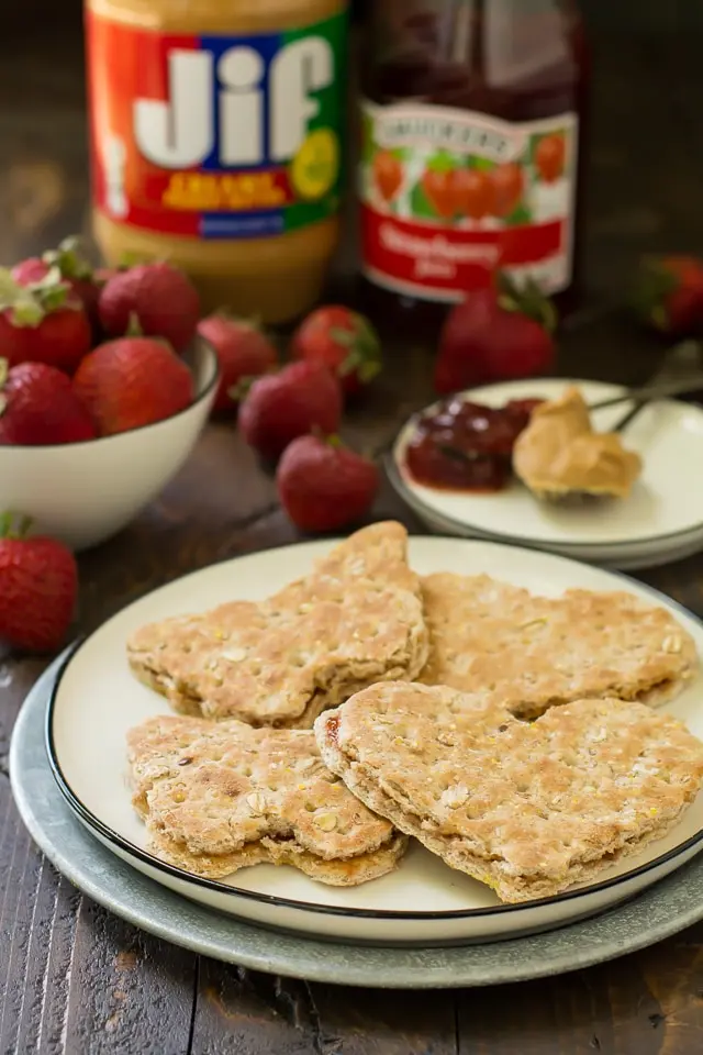 image of a peanut butter and jelly sandwich cut into shapes on a plate