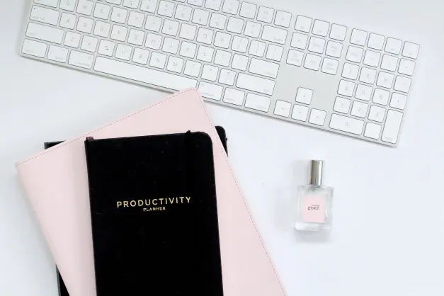 image of a productivity planner and a keyboard