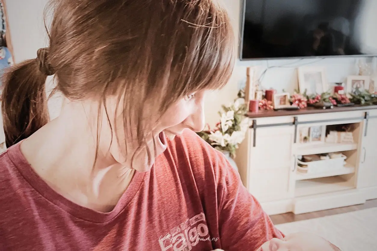 image of a woman smiling at a baby