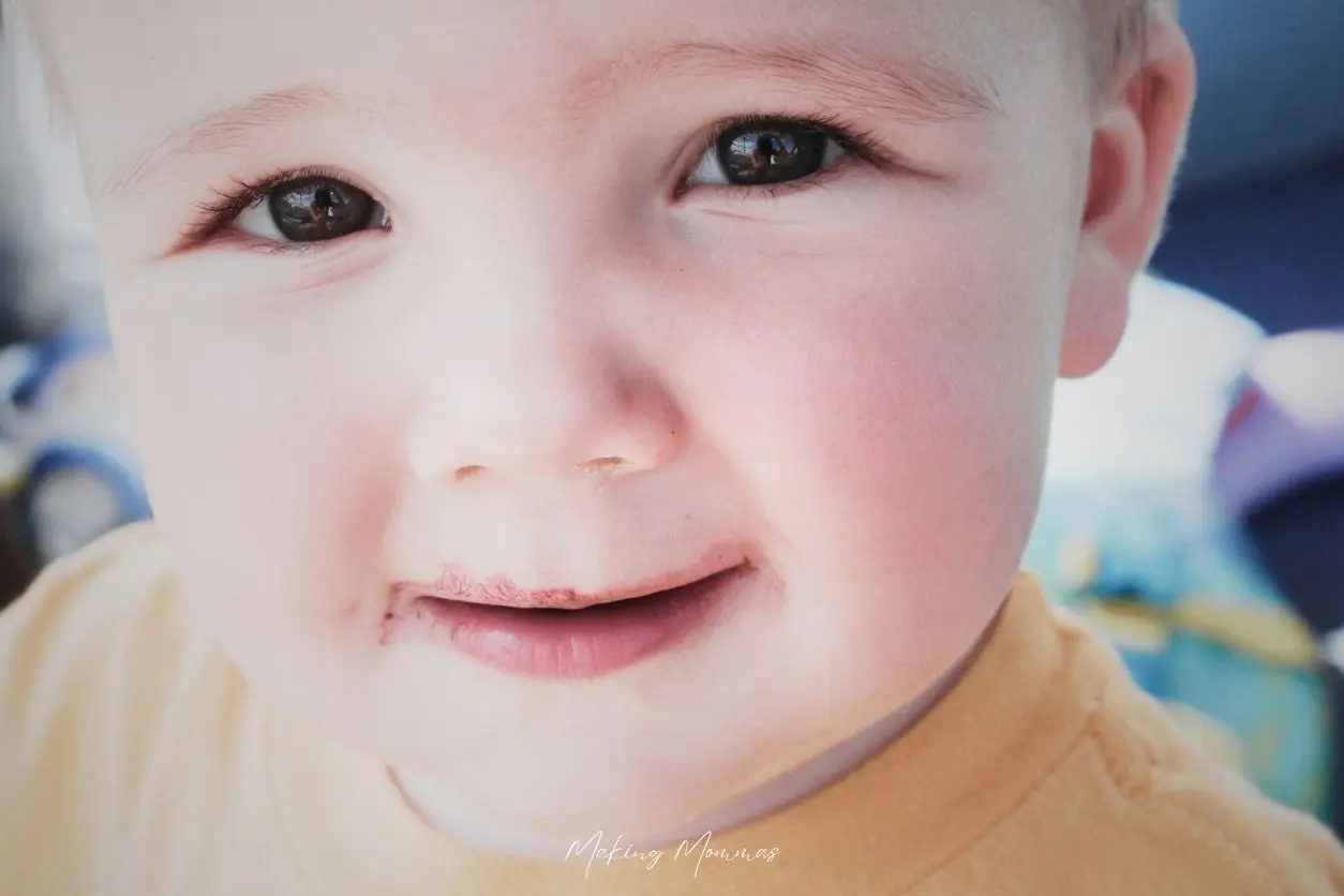 image of a toddler close up so it's just his face and big brown eyes