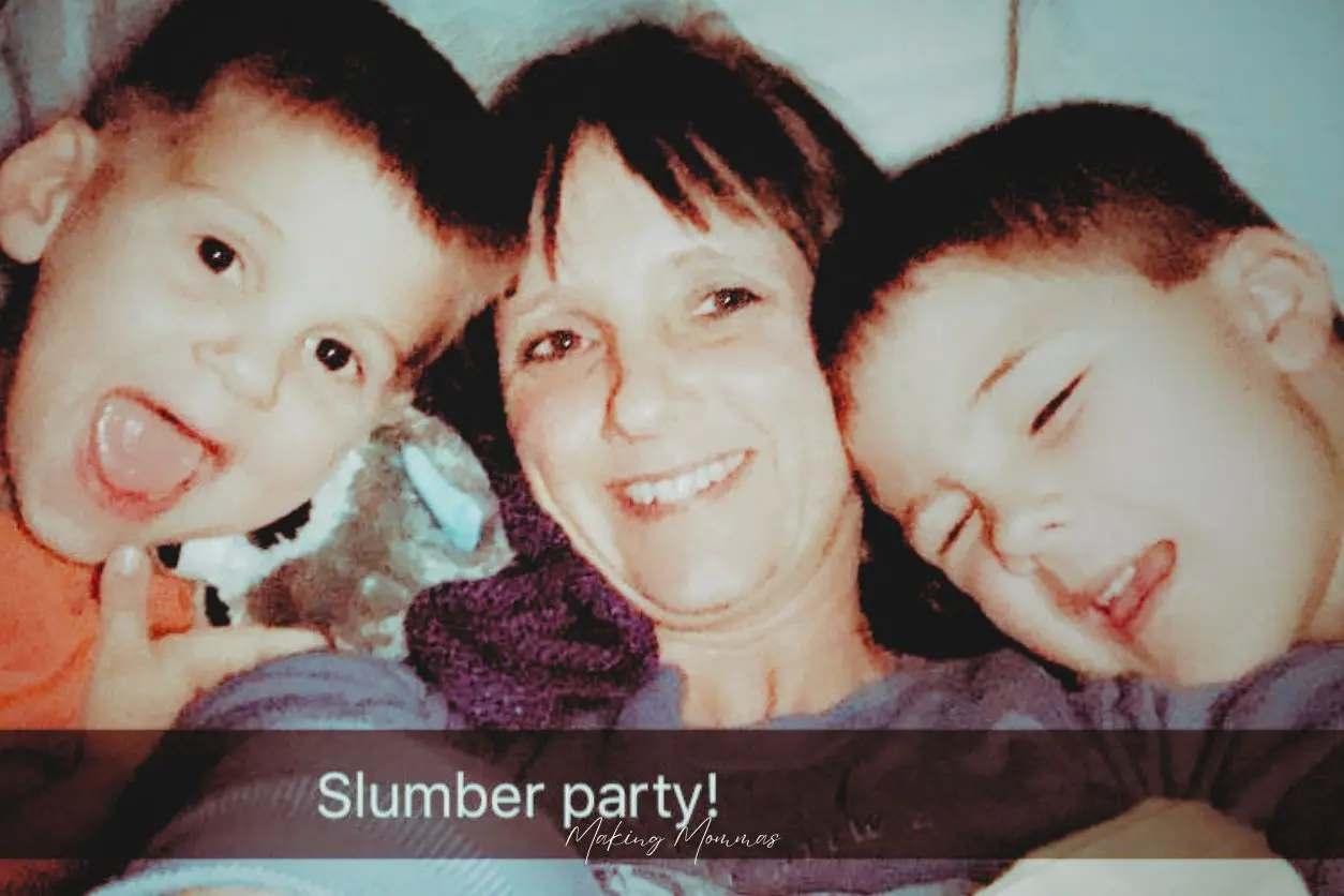 image of a mom and two boys with a ribbon across the photo that reads, "slumber party!"