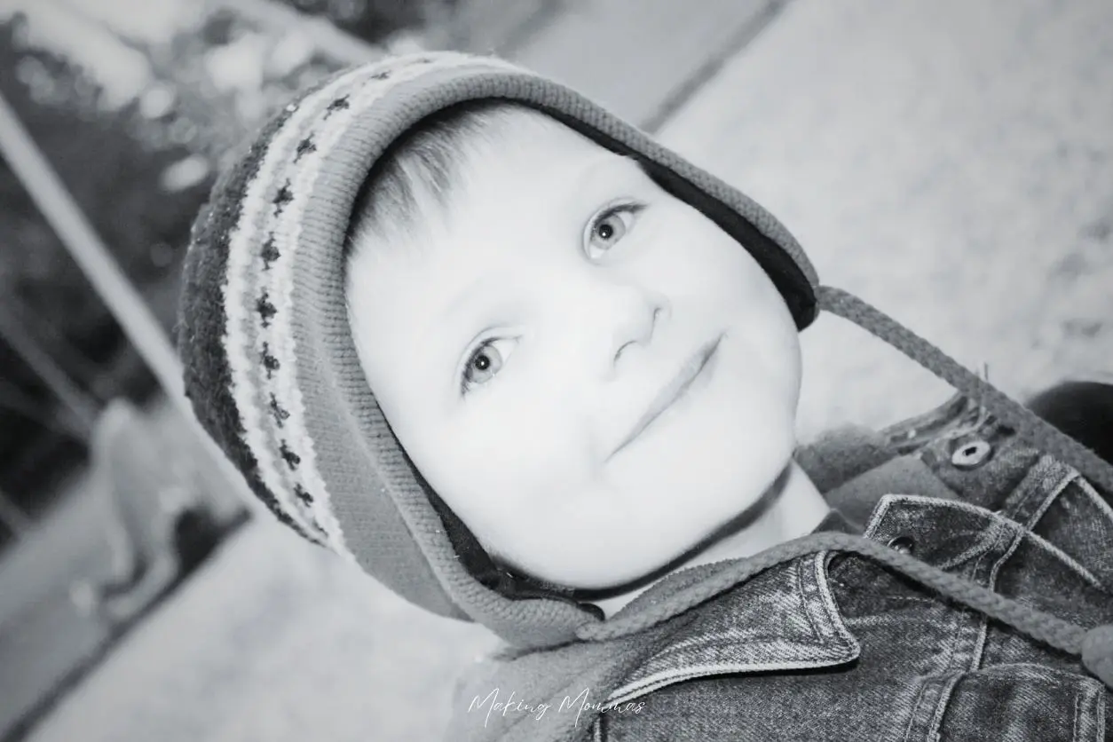 image of a little boy in a playground with a stocking cap on