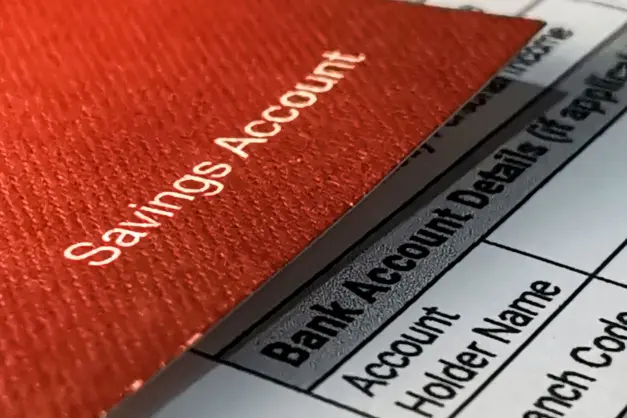 image of a red savings account booklet and a statement
