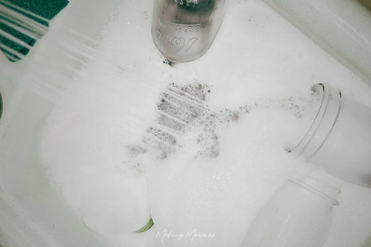 image of jars in a soapy sink