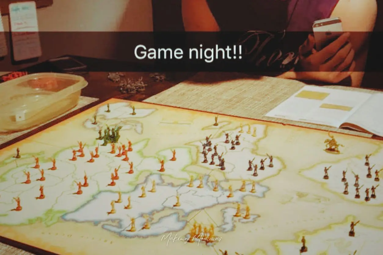 an image of a family playing Risk.