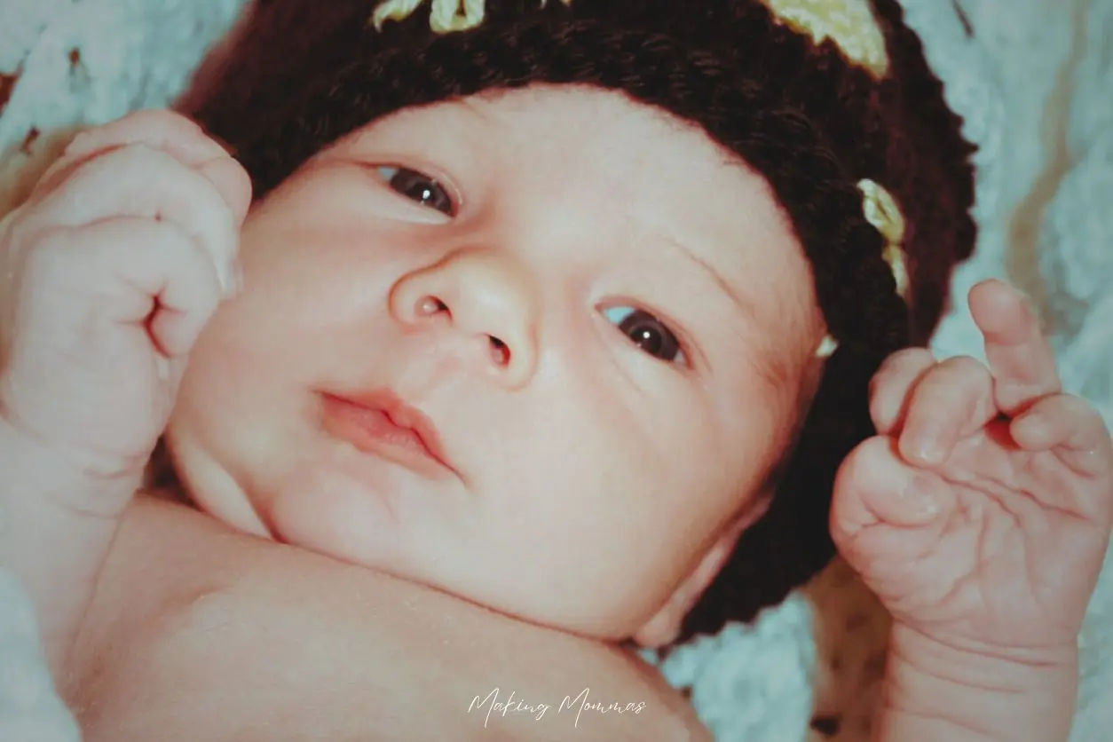 image of a baby in a crocheted hat